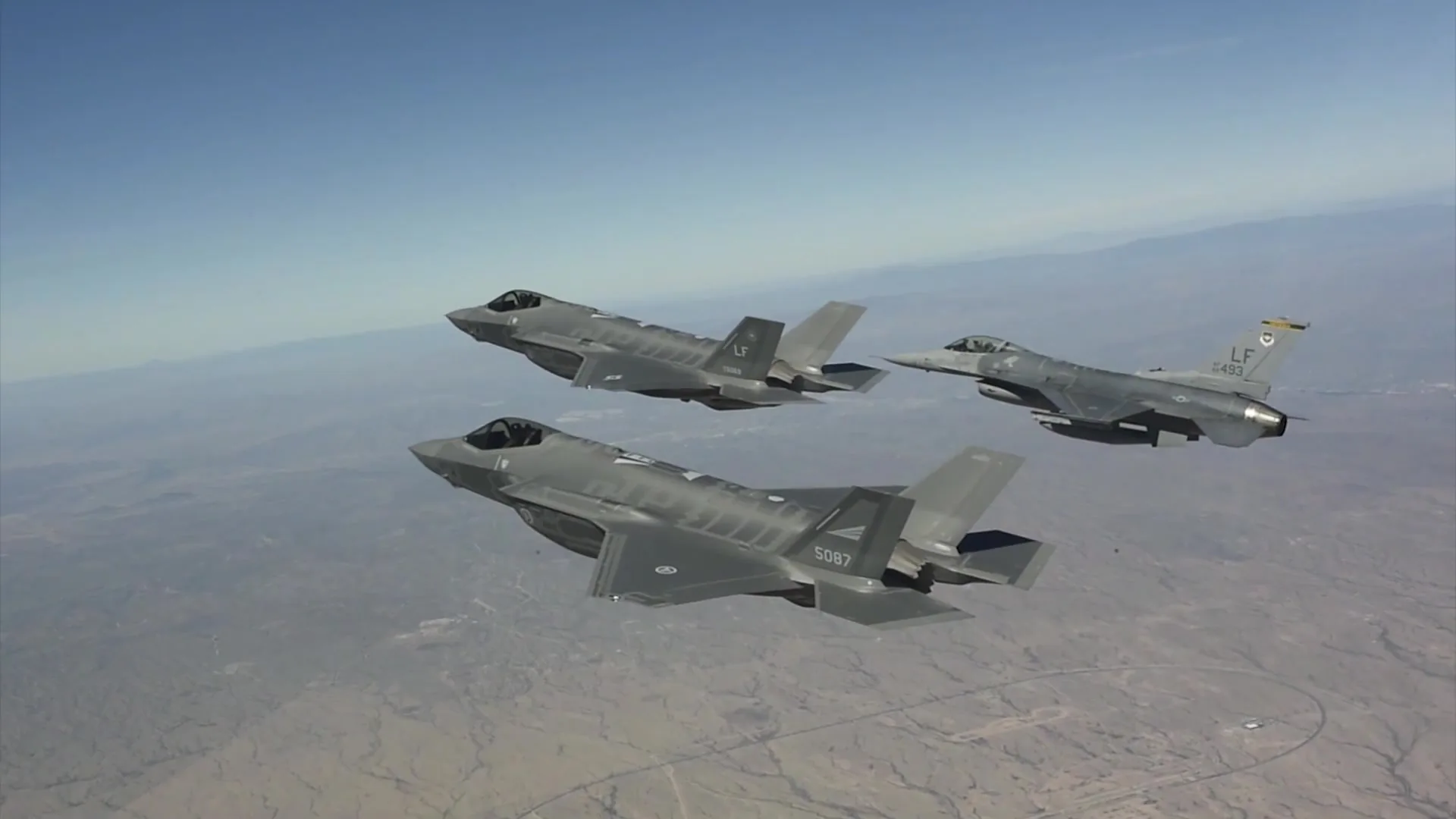 F-35A and F-16 aircraft in formation above Arizona, archival training flight